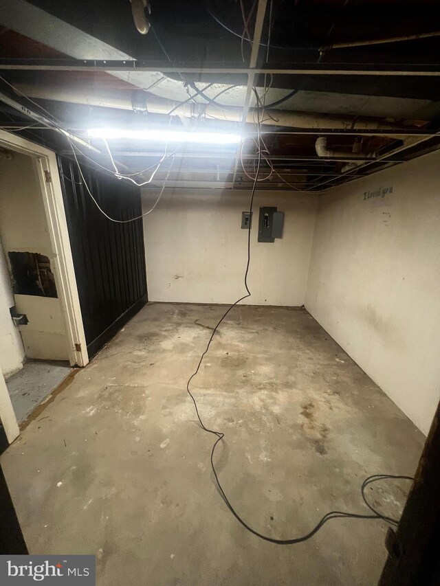 basement featuring electric panel