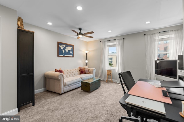 office area featuring ceiling fan and light colored carpet