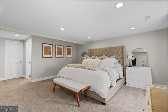 bedroom featuring light colored carpet