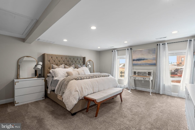 carpeted bedroom featuring beamed ceiling and multiple windows