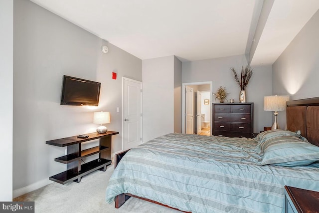 bedroom featuring carpet and baseboards