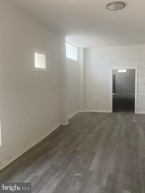 spare room with hardwood / wood-style floors