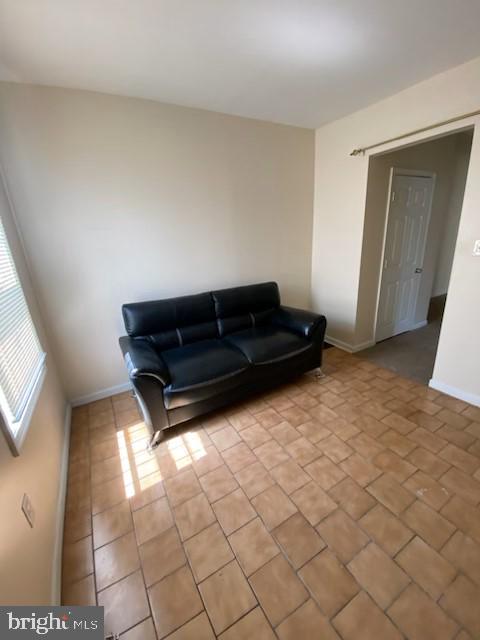 living room featuring light tile patterned floors