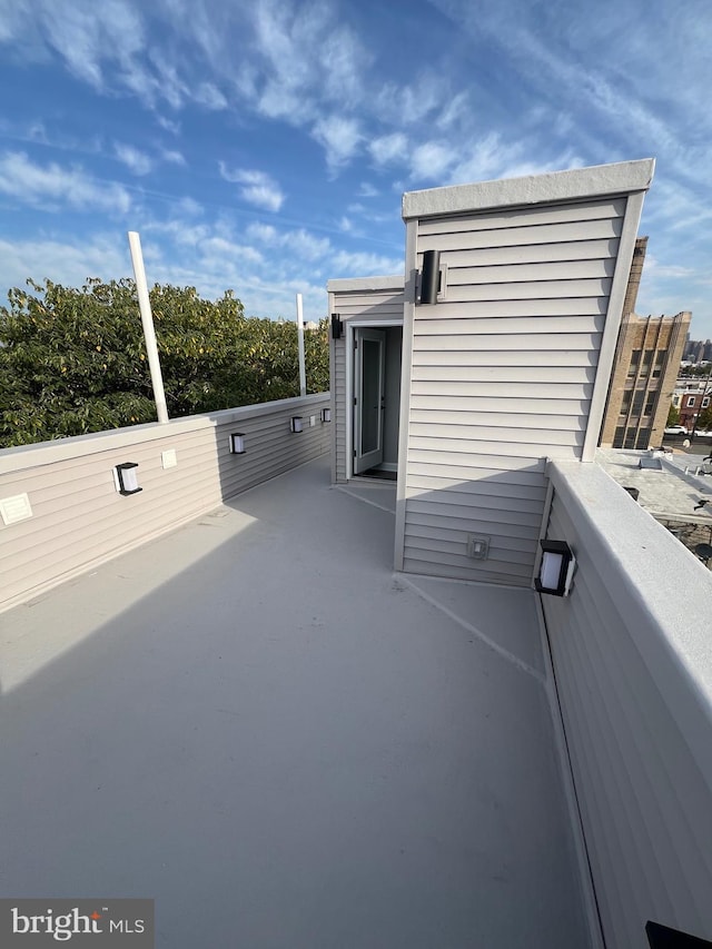 view of patio with a balcony