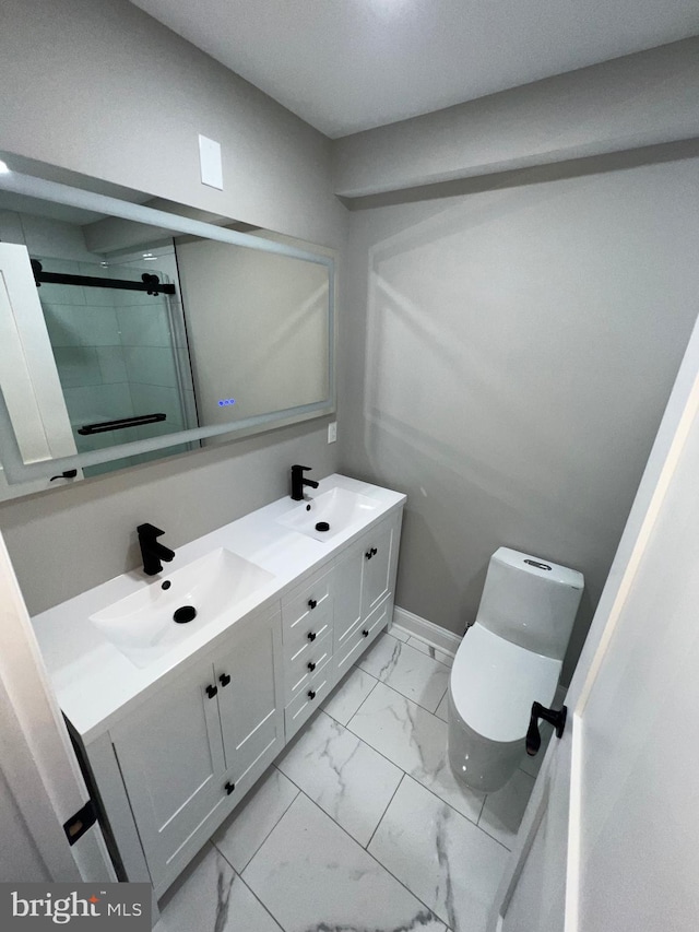 bathroom featuring vanity, toilet, and an enclosed shower