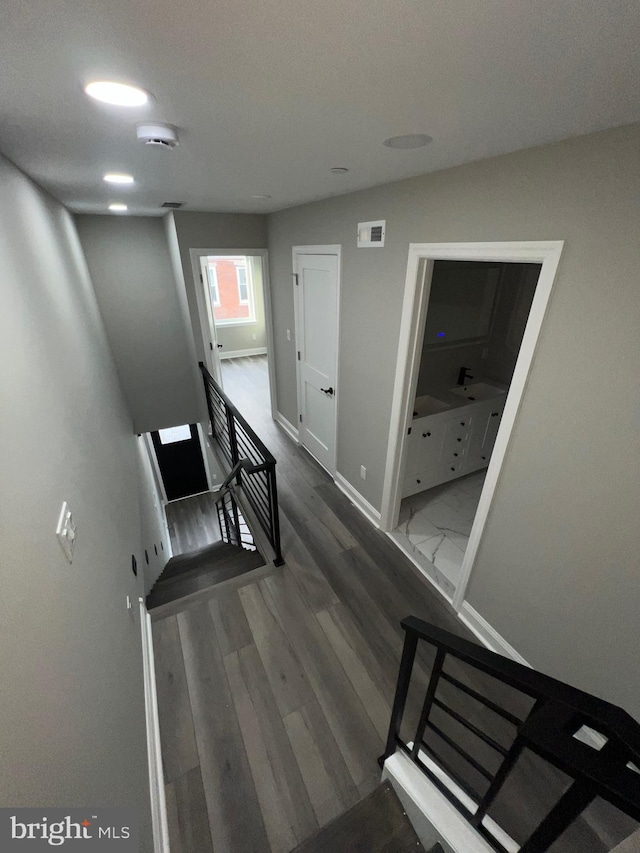 stairway featuring hardwood / wood-style floors