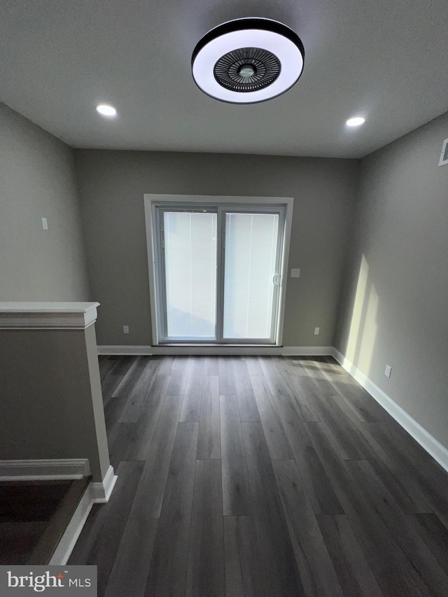 empty room with dark hardwood / wood-style floors