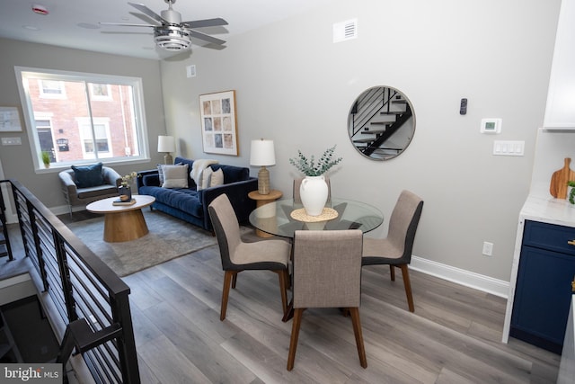 dining area featuring ceiling fan and light hardwood / wood-style floors