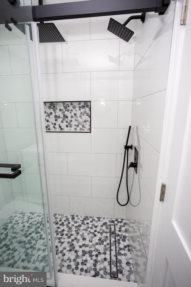 bathroom featuring an enclosed shower