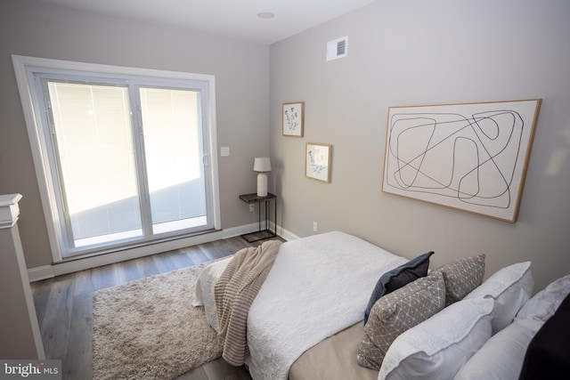 bedroom with hardwood / wood-style floors