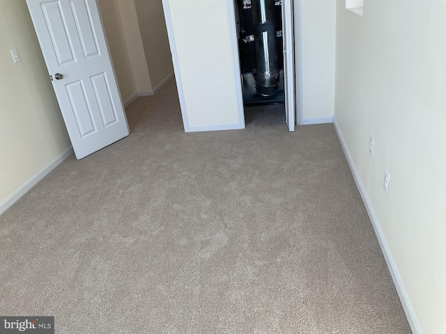 unfurnished bedroom with light carpet