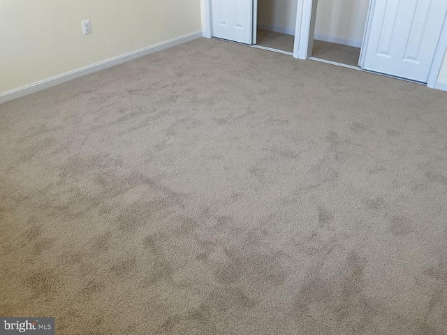 unfurnished bedroom with light carpet