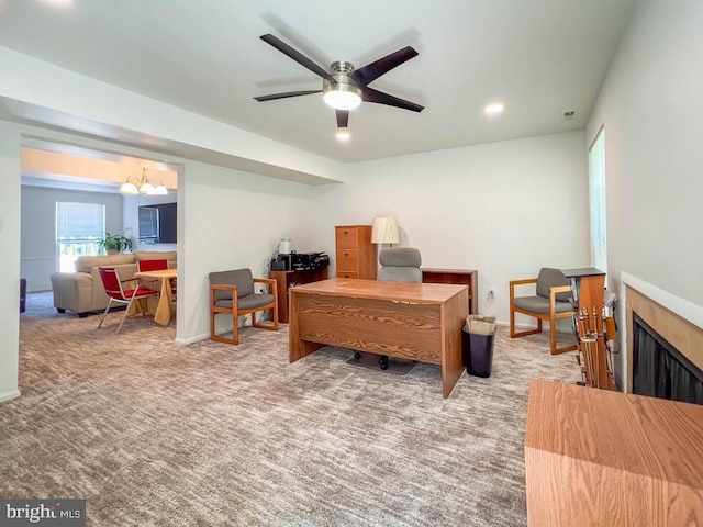 interior space with ceiling fan with notable chandelier and light colored carpet