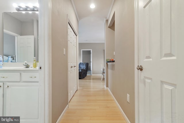 corridor with light hardwood / wood-style flooring