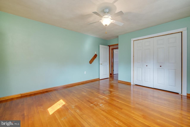 unfurnished bedroom featuring a closet, ceiling fan, and light hardwood / wood-style floors