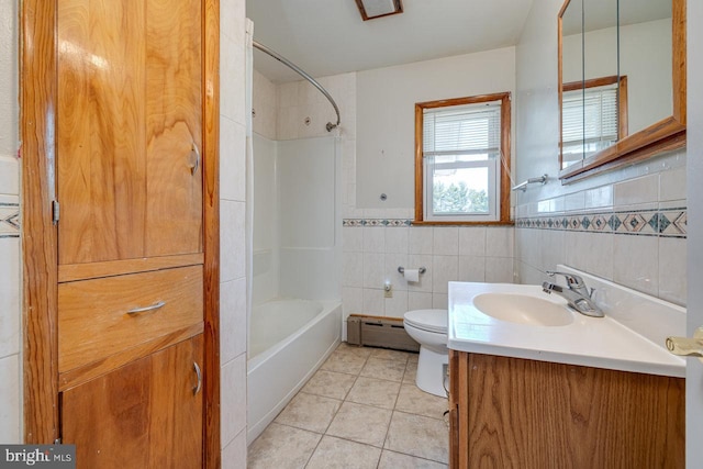 full bathroom featuring toilet, tile patterned flooring, vanity, a baseboard radiator, and tile walls