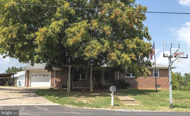 view of front of home featuring a garage and a front lawn