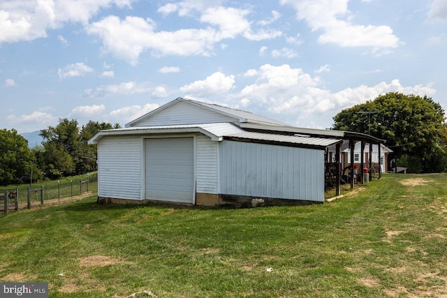 view of outbuilding featuring a yard