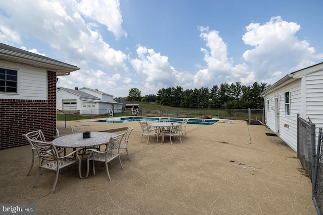 view of patio featuring a fenced in pool