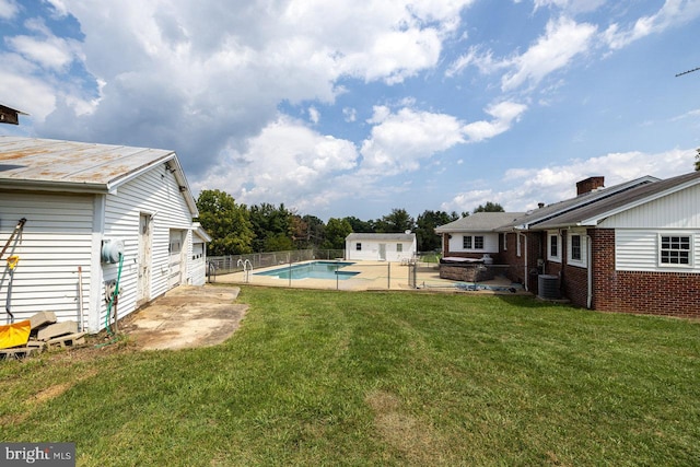 view of yard with a fenced in pool, a patio, and central air condition unit