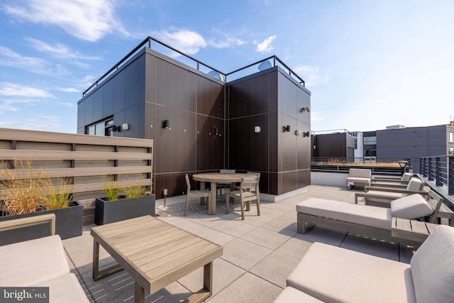 view of patio featuring outdoor dining area and an outdoor hangout area