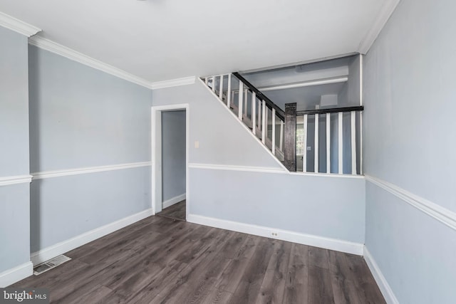 stairs with ornamental molding and wood-type flooring