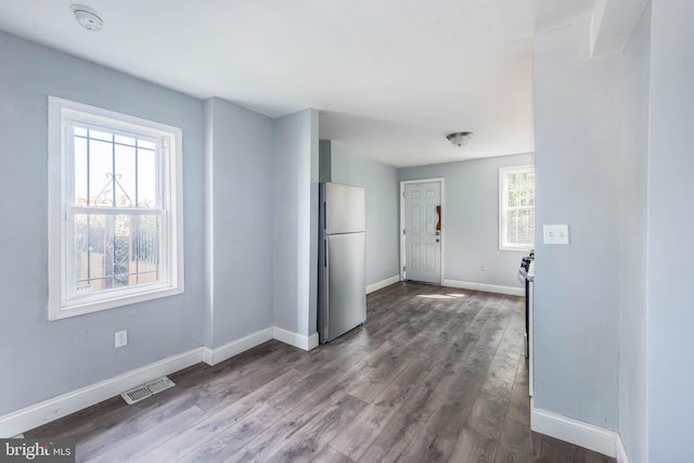 spare room with hardwood / wood-style floors