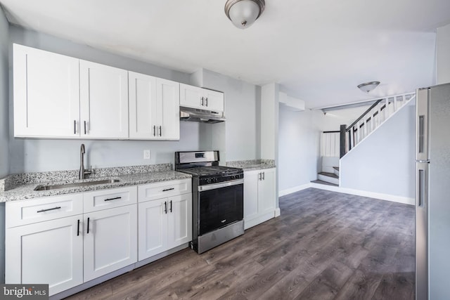 kitchen featuring sink, stainless steel appliances, dark wood-type flooring, and white cabinets