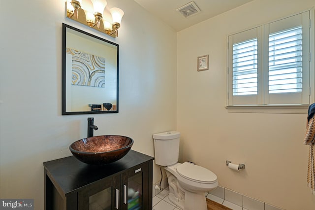 bathroom with tile patterned floors, toilet, and vanity