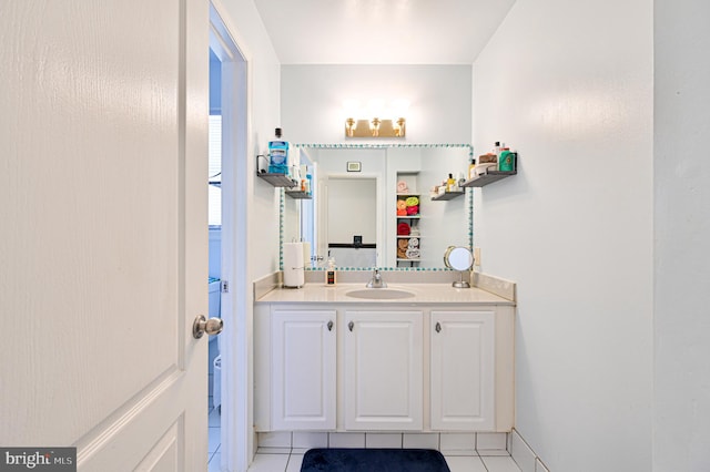 bathroom with tile patterned flooring and vanity