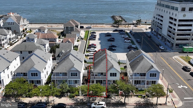 aerial view with a water view and a residential view