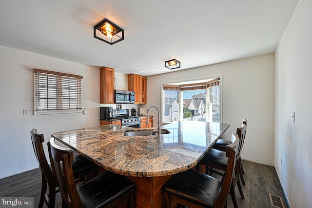 dining area featuring dark hardwood / wood-style flooring and sink