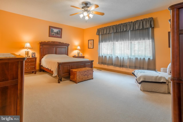 bedroom featuring ceiling fan and light colored carpet