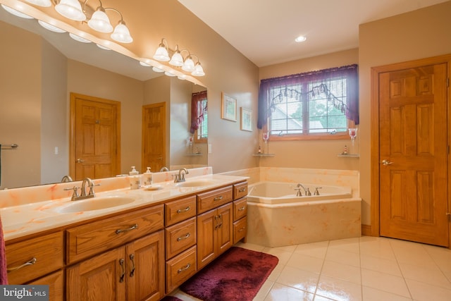 bathroom with a bath, tile patterned floors, and dual bowl vanity