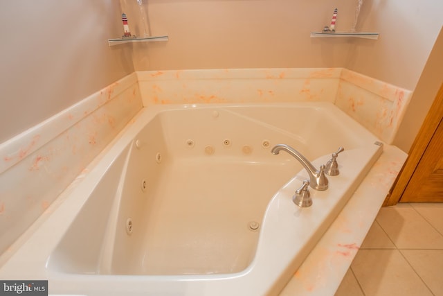 bathroom with tile patterned flooring and a bathing tub