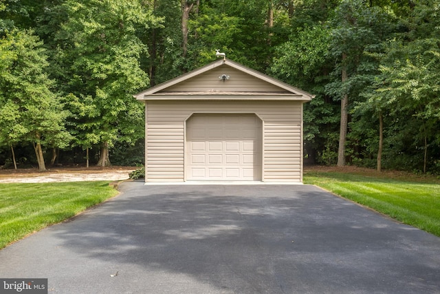 garage featuring a yard