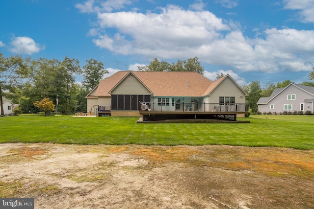 exterior space featuring a wooden deck, a sunroom, and a front lawn