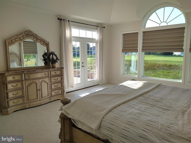 bedroom featuring access to outside, french doors, and light colored carpet