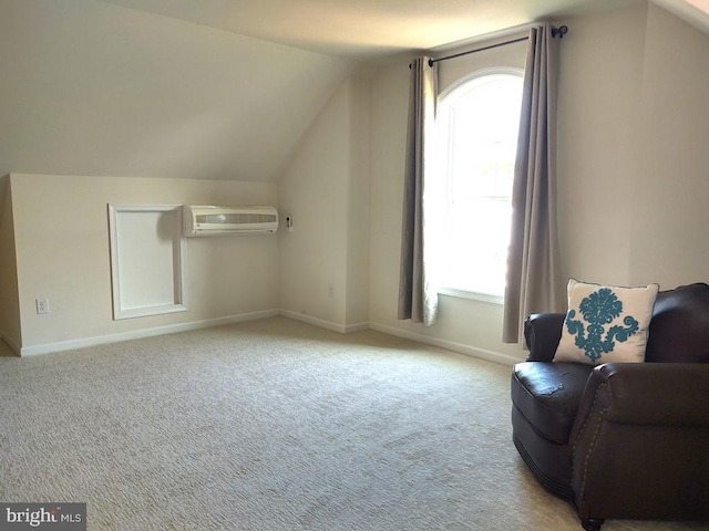 bonus room featuring carpet flooring, a wall mounted air conditioner, baseboards, and vaulted ceiling