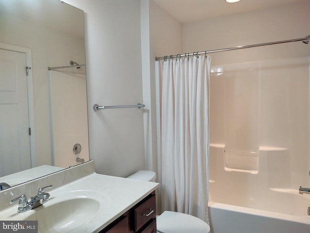 full bath featuring vanity, toilet, and shower / bath combo with shower curtain