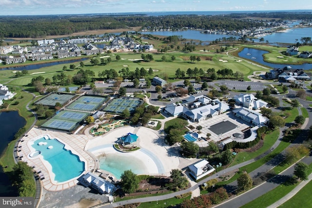 birds eye view of property featuring golf course view, a water view, and a residential view