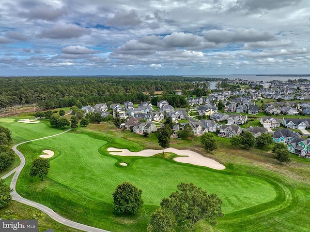 aerial view featuring a residential view, golf course view, and a water view