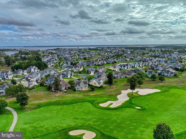 bird's eye view featuring a residential view, golf course view, and a water view