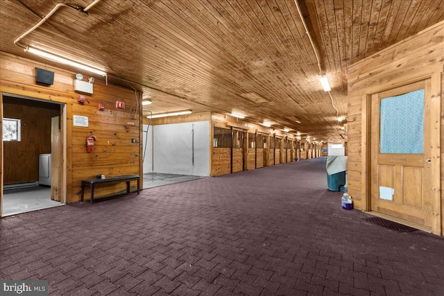 view of horse barn featuring washer / dryer