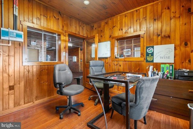 home office featuring wooden ceiling, wood finished floors, and wood walls