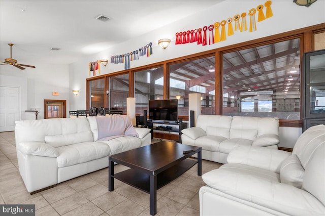 living room featuring light tile patterned floors and ceiling fan