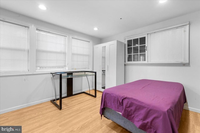 bedroom with recessed lighting, baseboards, and light wood-style floors