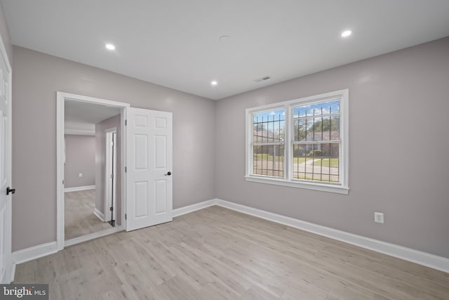 unfurnished bedroom with light hardwood / wood-style floors