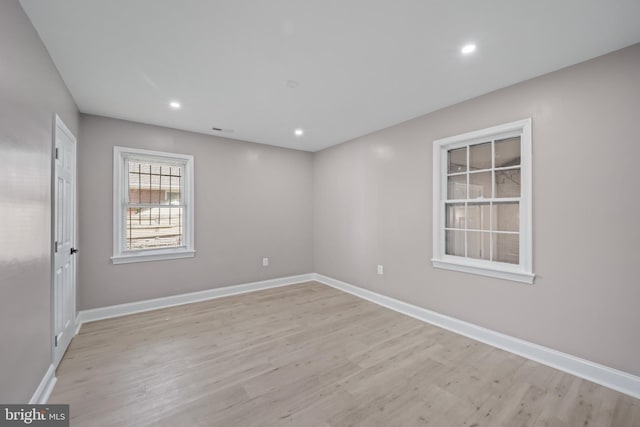 spare room featuring light wood-type flooring