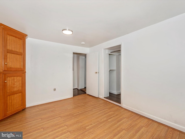 unfurnished bedroom featuring light wood-type flooring